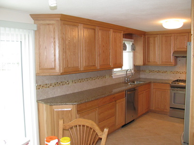 Remodeled kitchen, sink/dishwasher area, wide view.