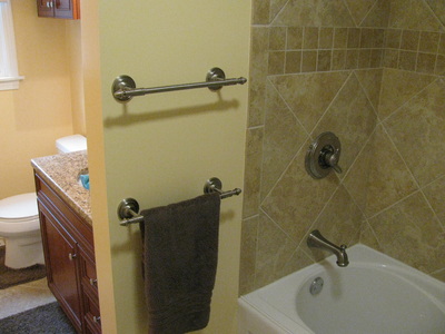Remodeled bath and towel hangers.