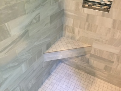 Shower, remodeled tile corner shelf.