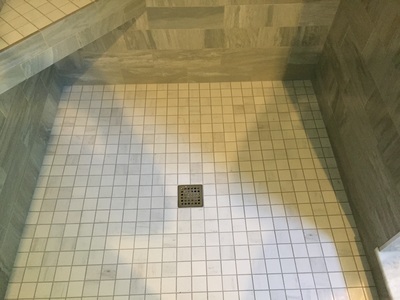 Shower, remodeled tile flooring.